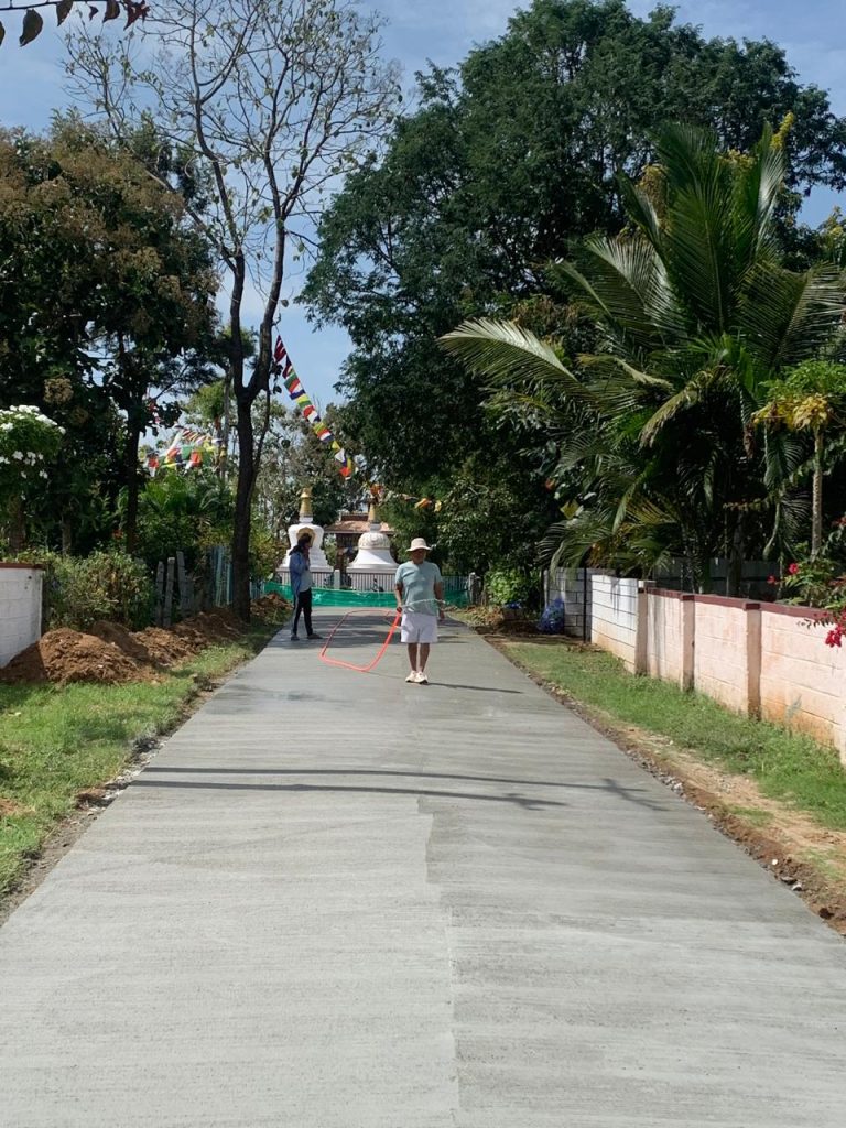 Hunsur A-Village Road construction completion report – home